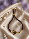Pulsera de cordón chocolate, dije llave con corazón (hecha a mano)